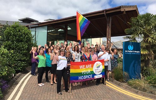 St Peter's Hospice staff members with the Pride flag