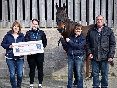 Bounty Pursuit with a cheque for the Hospice