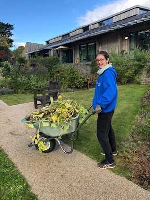 A volunteer with wheelbarrow