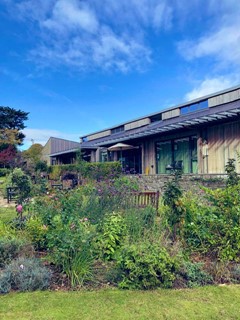 The Hospice garden under a blue sky