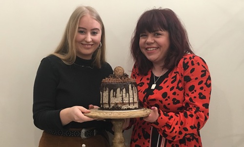 Briony and Charlotte with the winning cake