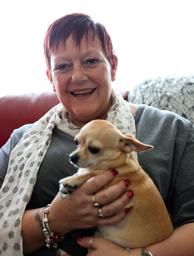 Maria at home with her dog